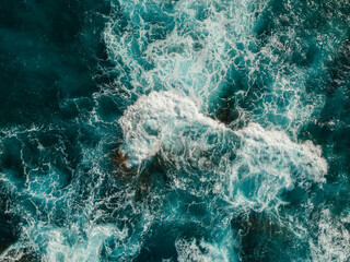 Aerial View of the Sea and Waves. The vast ocean stretches endlessly, with waves. Nature, tranquility, and adventure.	