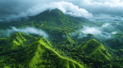 Lush, verdant mountain range shrouded in mist