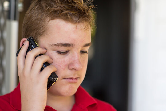 Troubled teenager on mobile phone