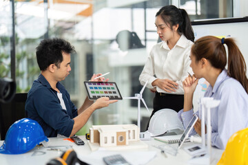 Team Collaboration on Sustainable Design. Engineer analyzing project data in a modern workspace.