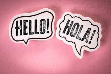 Hello. English and Spanish. Speech Bubbles on Pink Background Representing Multilingual Greeting...