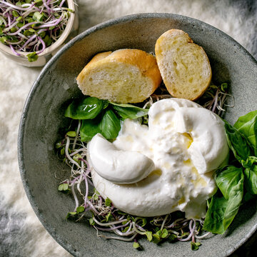 Traditional italian burrata knotted cheese in bowl