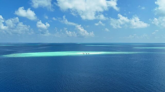 Summer lagoon Ripples in the sand at low tide on a beach with sandbar and blue sea in Maldives island