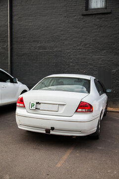 P2 plate car parked over line in car park