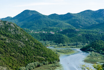 Crnojevica River flows into Lake Skadar, summer mountains Montenegro landscape