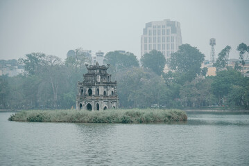 Turtle Tower on Hoan Kiem Lake in cloudy weather, landmark of Hanoi, Vietnam