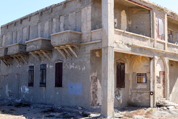 Ruins of old houses in the center of a big city