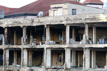 Ruins of old houses in the center of a big city