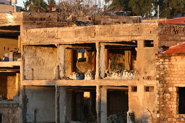 Ruins of old houses in the center of a big city