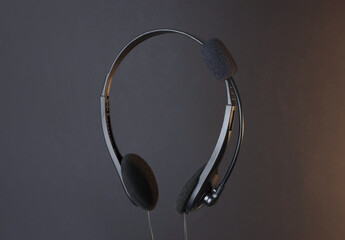 Headset with microphone in air on dark background