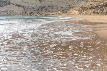 waves on the sandy beach of Cyprus..