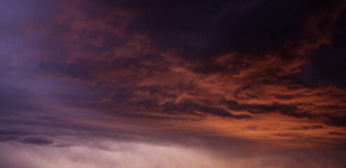 Obraz premium Sunset sky with orange clouds. Nature background.