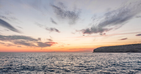 Dramatic Sunset Highlights Azure Ocean Beauty.