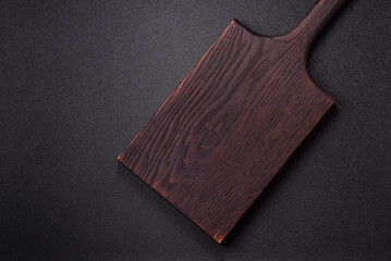 Wooden cutting board blank as a backdrop for cooking in the kitchen