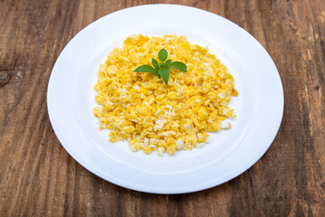 Scrambled egg on white plate.