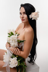 Brunette beauty adorned with flowers in a serene natural setting