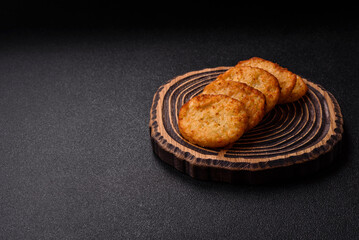 Potato hash browns, a meal with onions, cabbage in the form of fritters