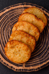 Potato hash browns, a meal with onions, cabbage in the form of fritters