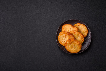 Potato hash browns, a meal with onions, cabbage in the form of fritters
