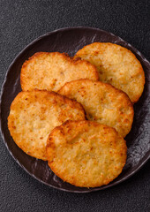 Potato hash browns, a meal with onions, cabbage in the form of fritters
