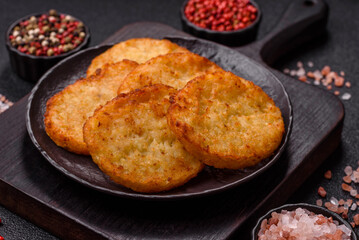 Potato hash browns, a meal with onions, cabbage in the form of fritters
