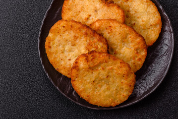 Potato hash browns, a meal with onions, cabbage in the form of fritters