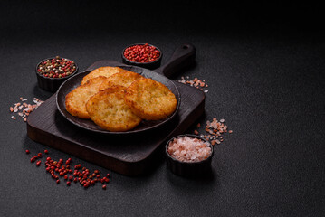 Potato hash browns, a meal with onions, cabbage in the form of fritters