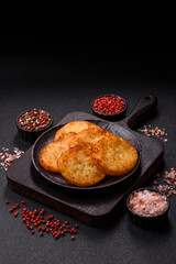 Potato hash browns, a meal with onions, cabbage in the form of fritters