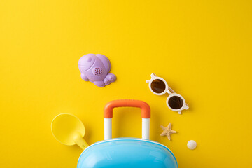 A vibrant yellow backdrop features beach toys, sunglasses, a small suitcase, and summer objects