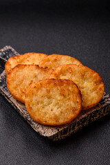 Potato hash browns, a meal with onions, cabbage in the form of fritters
