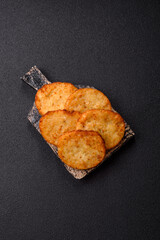 Potato hash browns, a meal with onions, cabbage in the form of fritters