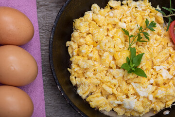 Scrambled eggs in metal pan