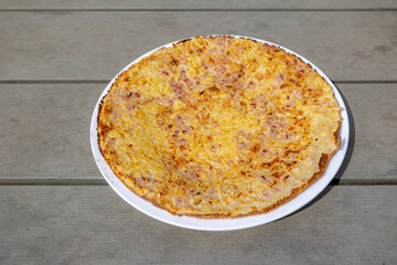 Selective focus of ham and cheese Pannekoek on wooden table, Dutch pancake is a thin pancake that can be served sweet or savory, There are so many ways to enjoy this easy treat for breakfast or snack.