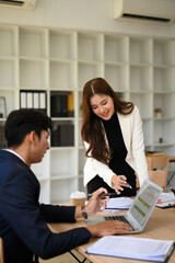 Vertical image of Business Colleagues in Strategic Office Discussion