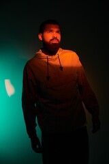 Handsome man enjoys a serene summer evening in vibrant sunset colors