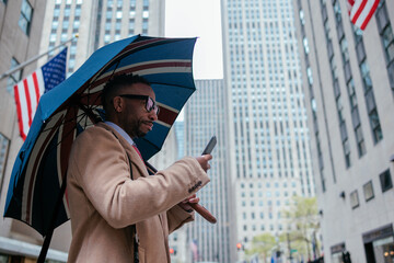 Manhattan backdrop with person on phone