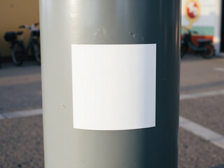Naklejka premium White Square on Urban Grey Post Mockup: Minimalist Street Scene