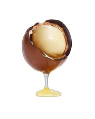 Halved Macadamia Nut with Dripping Oil Isolated on White Background
