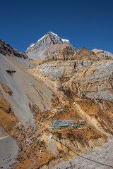 Thorung Phedi hotels at the foot of Yakwakang peak in autumn. Himalaya mountains, Nepal.