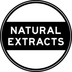 Black color round seal sticker in word natural extracts on white background