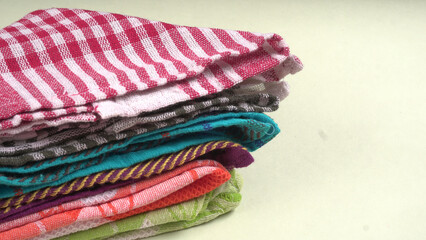 Clean sponge cloths with a checkered pattern isolated on white background. Household cleaning cloth. Closeup of cleaning rag isolated on a white background. Set of 5 sponge napkin isolated on a white.