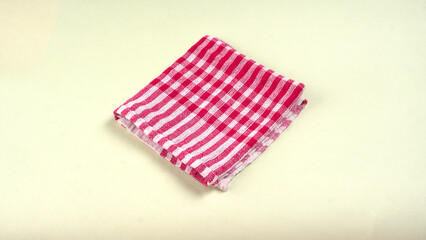 Clean sponge cloths with a checkered pattern isolated on white background. Household cleaning...