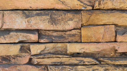 Natural Stone Texture with Warm Tones Showing Unique Patterns and Color Variations for Architectural Use