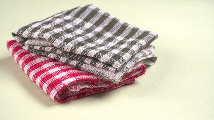 Clean sponge cloths with a checkered pattern isolated on white background. Household cleaning cloth. Closeup of cleaning rag isolated on a white background. Set of 5 sponge napkin isolated on a white.