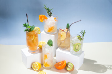 Summer cold cocktails with fruits and ice in glass glasses.
Advertising. Banner for bar