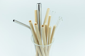 Straws of various materials in the cup
