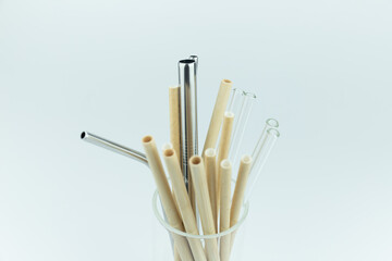Straws of various materials in the cup