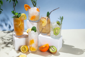 Summer cold cocktails with fruits and ice in glass glasses.
Advertising. Banner for bar