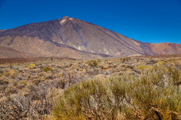 Captivating view of Mount Teide towering over a rugged volcanic landscape in Tenerife, Spain
