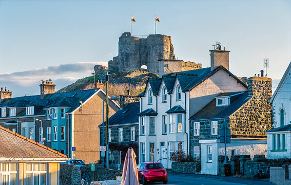 A view of the castle standing above the town at Criccieth, Wales in springtime